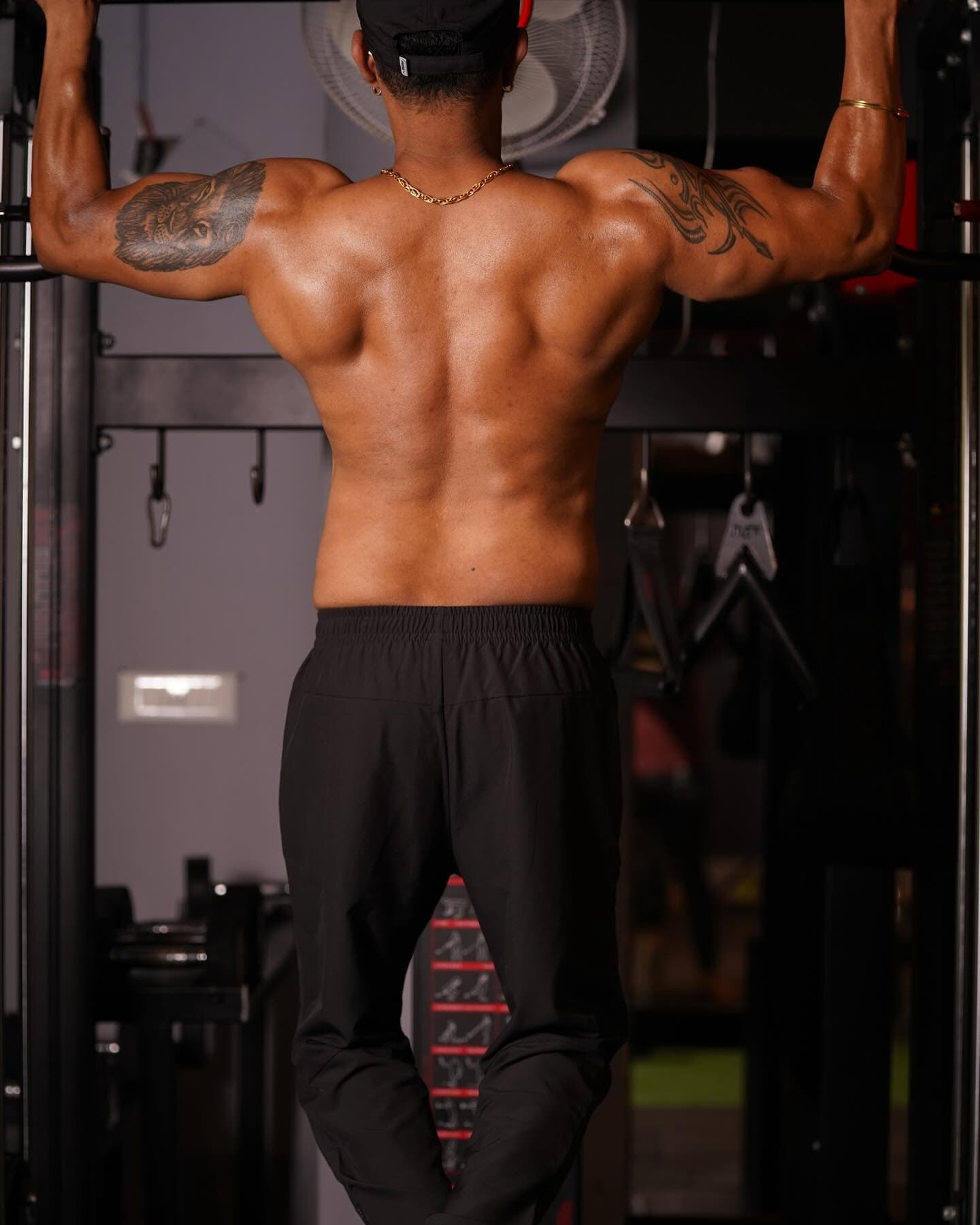 Member performing a pull-up, back and shoulders engaged